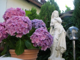 Flowers and Small Statue